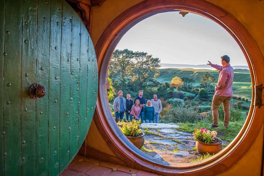 Auckland: Hobbiton Movie Set Day Trip with Festive Lunch - Entering Bagshot Row and a Hobbit hole